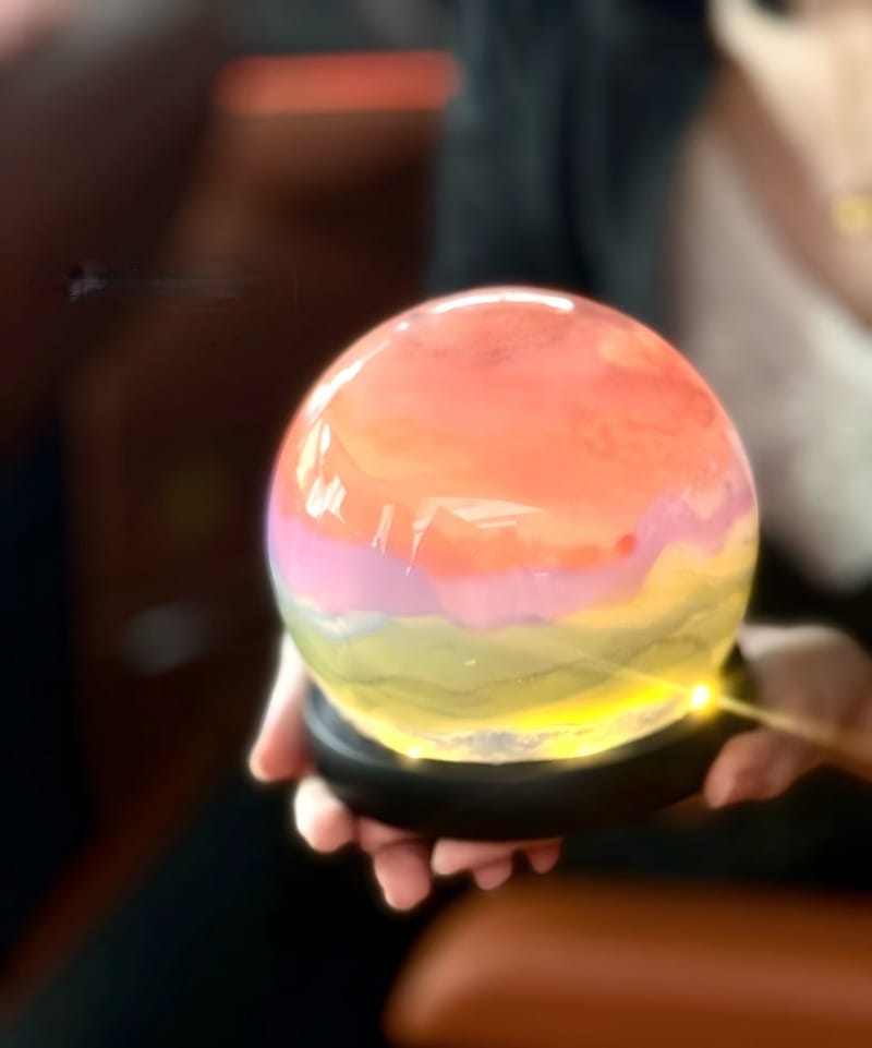 Glass ball-shaped light with colorful glowing effect