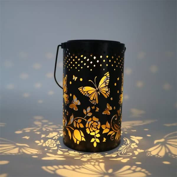 metal solar lantern with butterfly and rose cutouts, portable handle