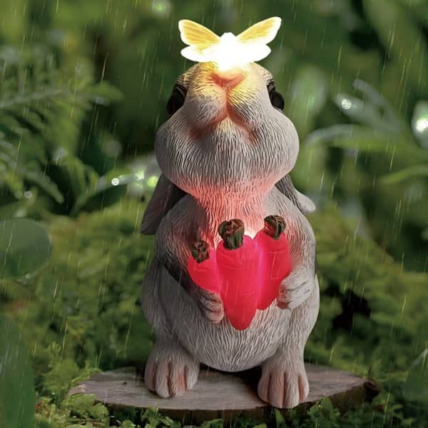 Resin rabbit statue solar light holding glowing hearts with butterfly topper (freestanding)