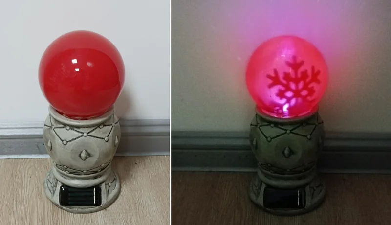 SM23405 Rotating Solar Stake Light Resin Statue with Snowflake Globe