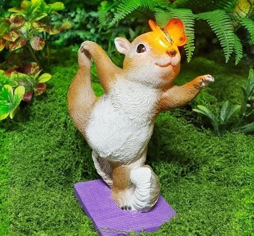 2. solar squirrel doing yoga with lighted butterfly