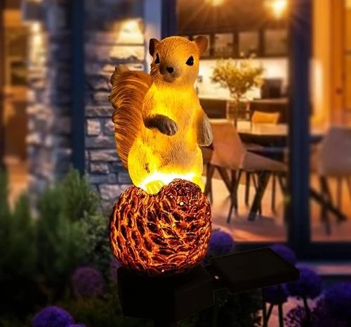 5. garden solar squirrel statue with pinecone