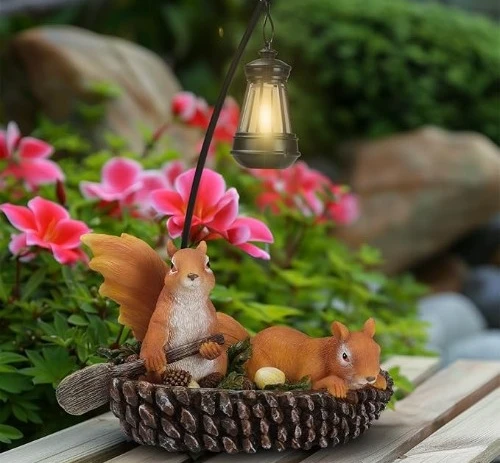 6. squirrel with solar lantern on pinecone boat