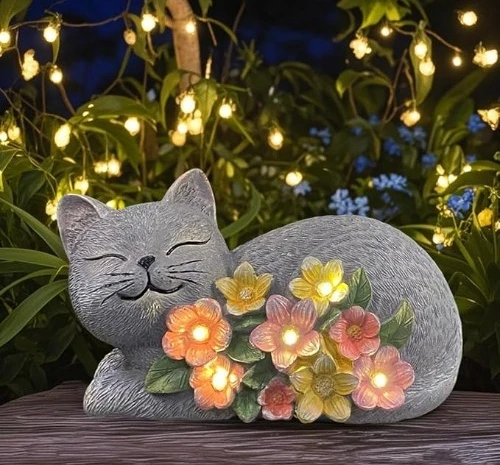 7 solar cat outdoor statue with colorful flowers